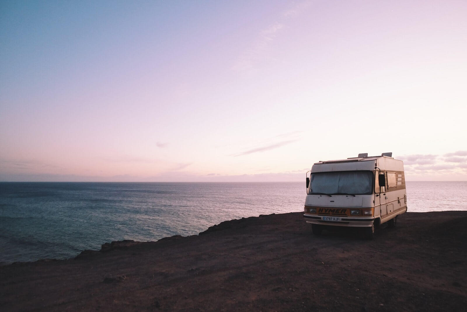 RV is parked near beach