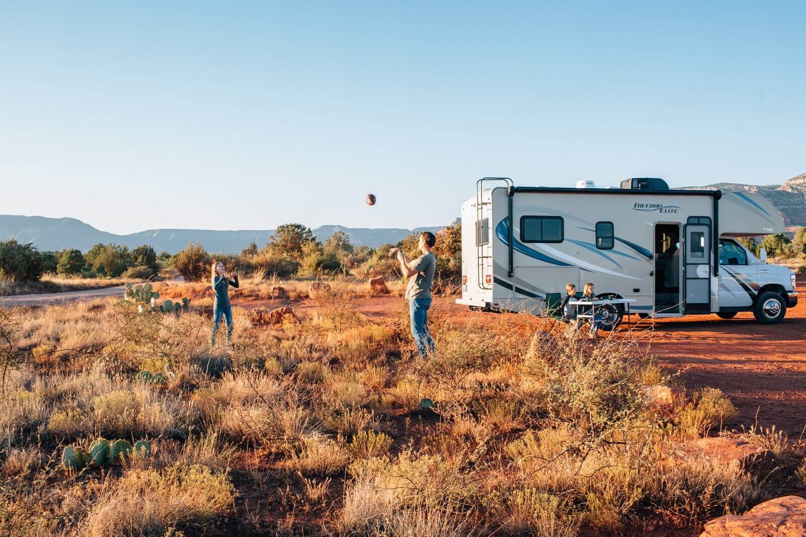 couple is playing in front of their new rv