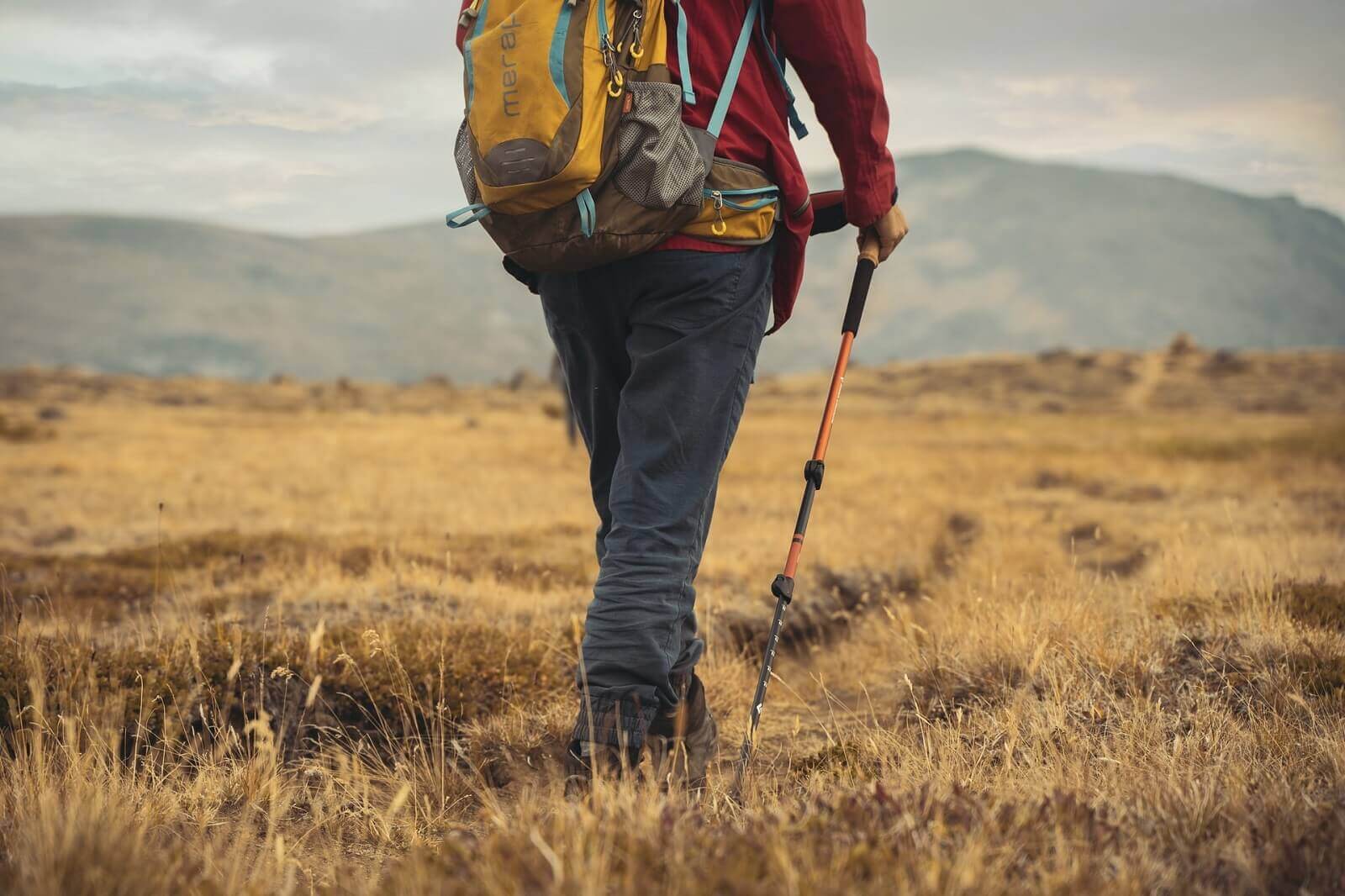 hiker is using trekking poles